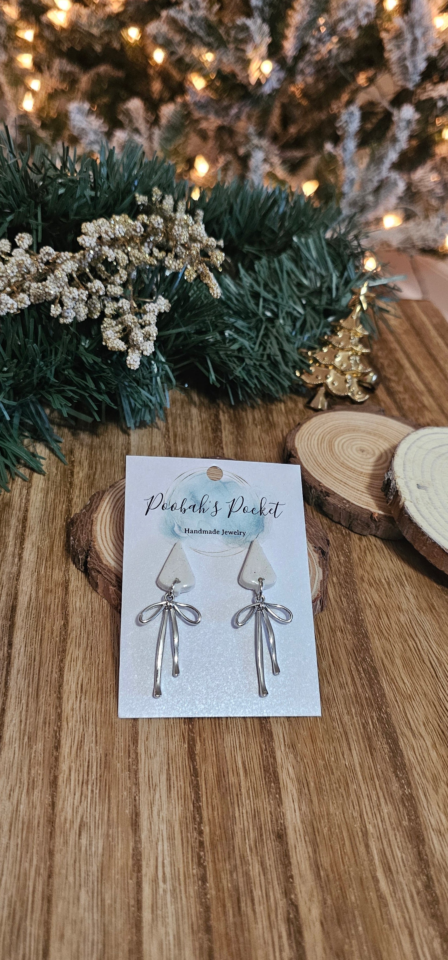 white Christmas Tree Earrings with silver bow hanging