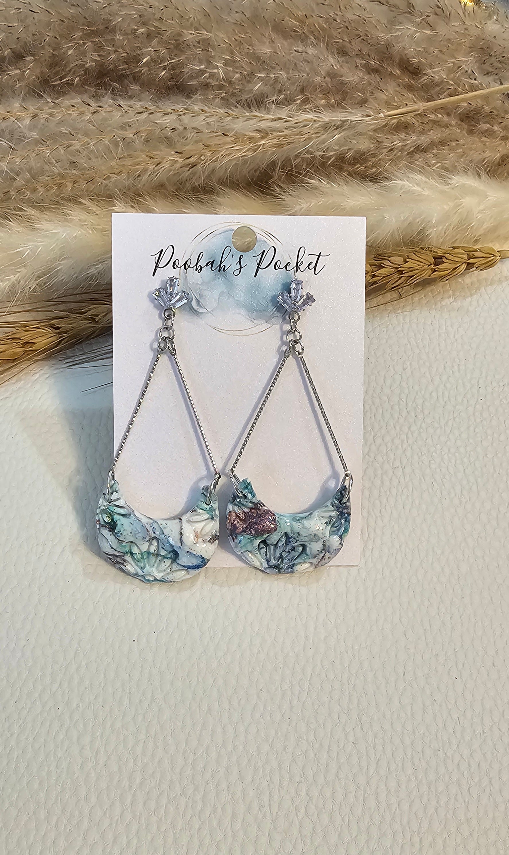 swinging moon earrings